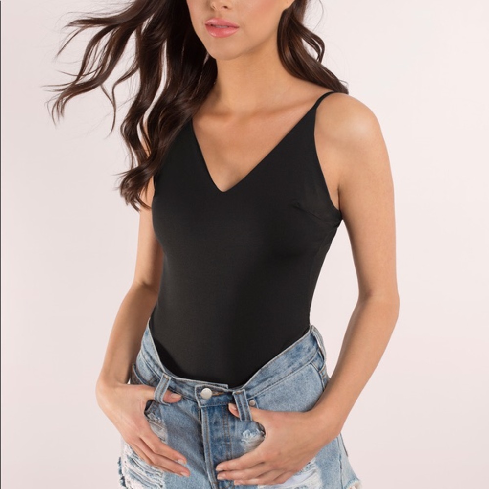 Black bodysuit with back bar detail. NWT